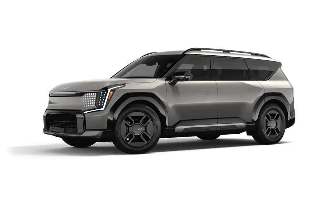 front three-quarter view of a Pebble Gray Kia EV9