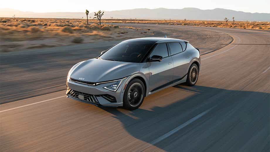 front three-quarter view of a Kia EV6 on a desert highway