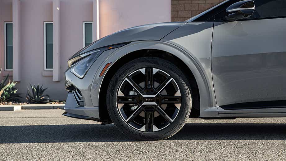 Front wheel and fender view of a Kia EV6