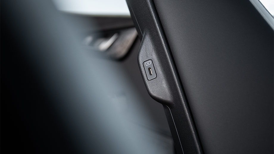 Close-up of a USB port on a Kia EV6 seatback