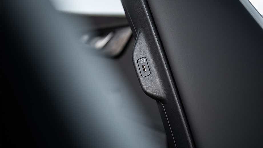 Close-up of a USB port on a Kia EV6 seatback