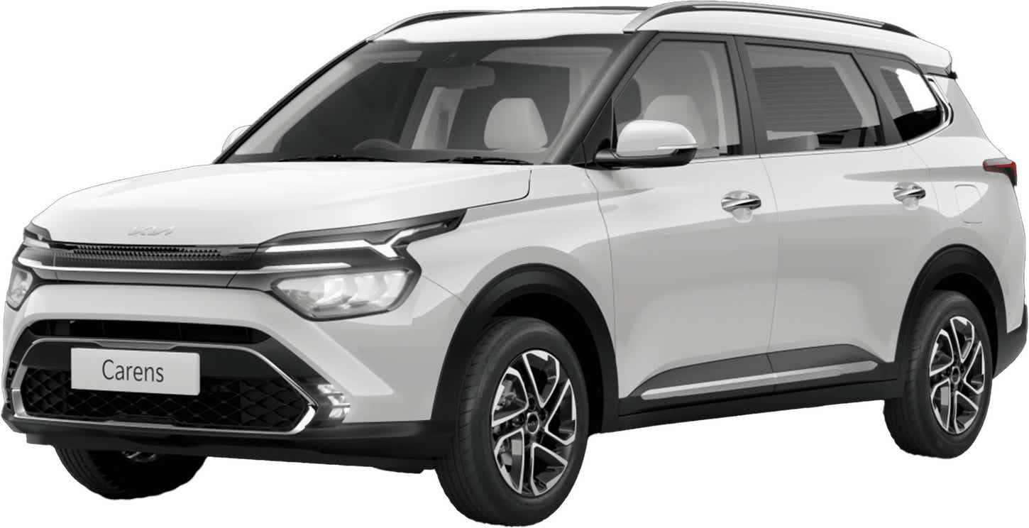 front three-quarter view of a Glacier White Pearl Kia Carens