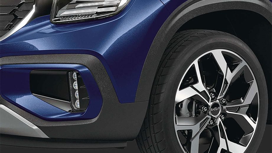 Front wheel and headlight area of a Kia Seltos