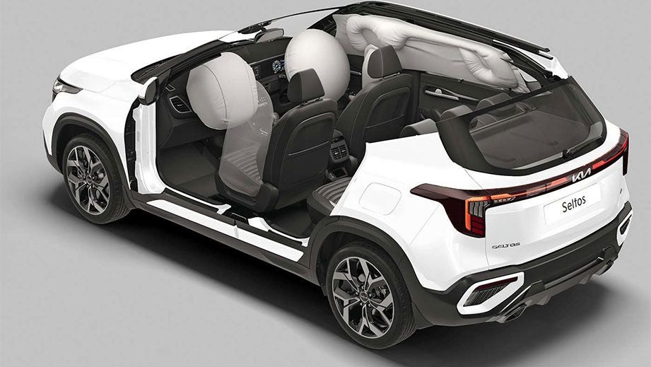 Rear three-quarter interior view of a Kia Seltos showcasing airbags