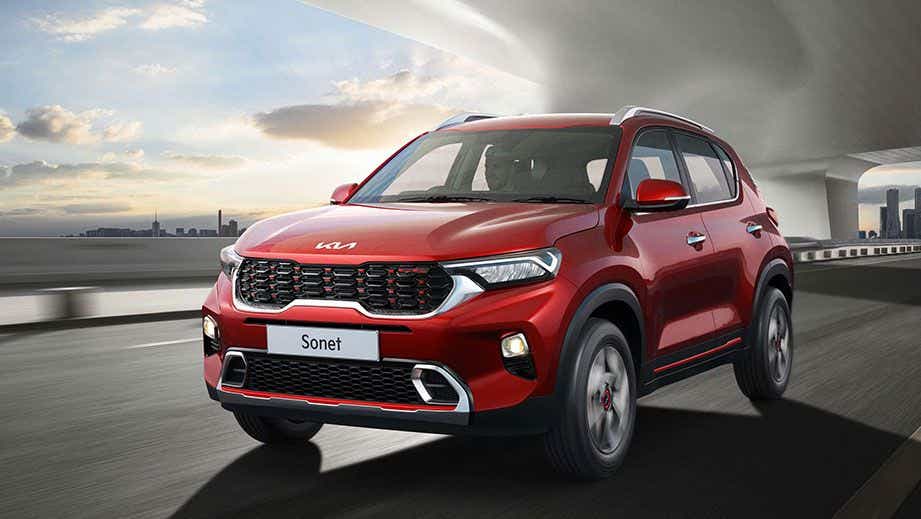 front three-quarter view of a Intense Red Kia Sonet 2020-2023