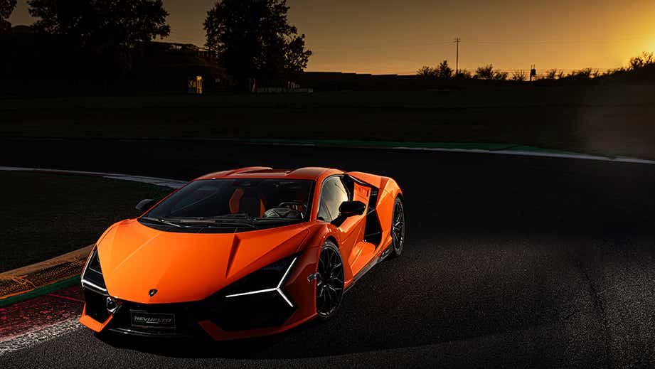front three-quarter view of a Lamborghini Revuelto at sunset