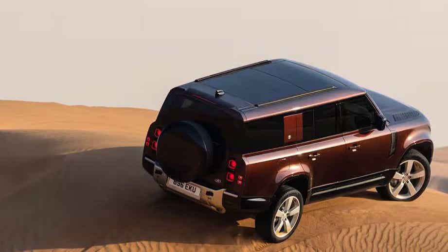 rear three-quarter view of a Land Rover Defender
