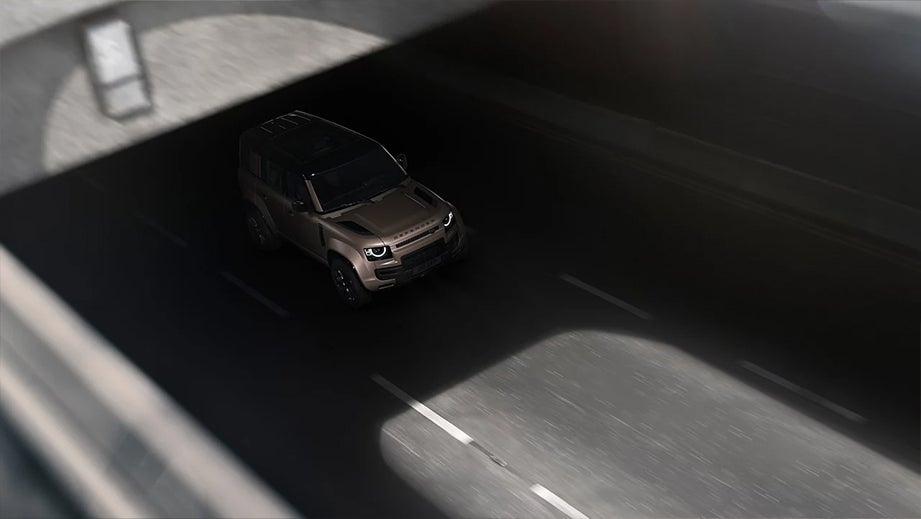 overhead view of a Land Rover Defender driving through a tunnel