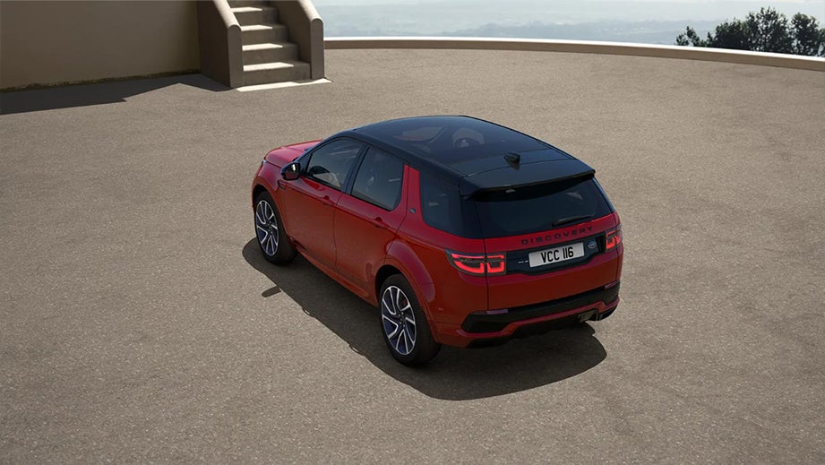 Rear three-quarter view of a Firenze Red Land Rover Discovery Sport
