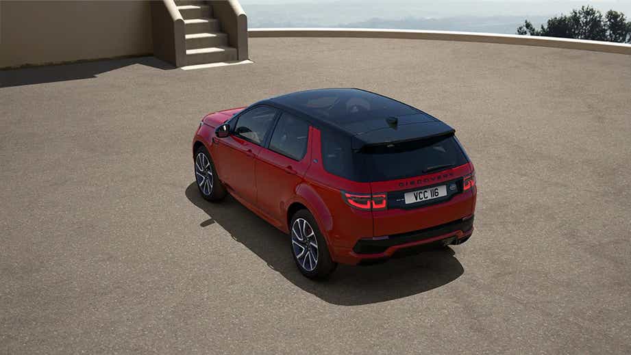 Rear three-quarter view of a Firenze Red Land Rover Discovery Sport