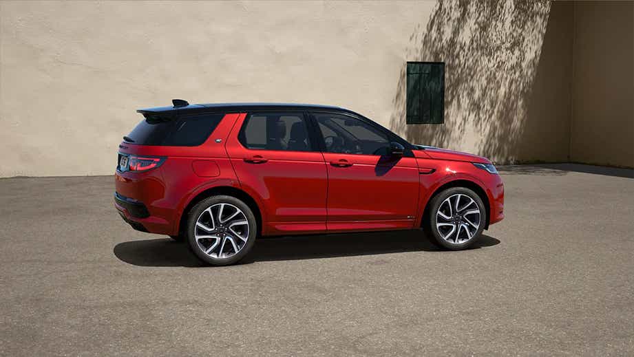 side view of a Firenze Red Land Rover Discovery Sport