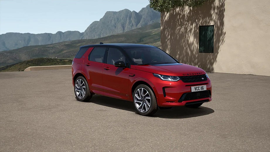 front three-quarter view of a Firenze Red Land Rover Discovery Sport