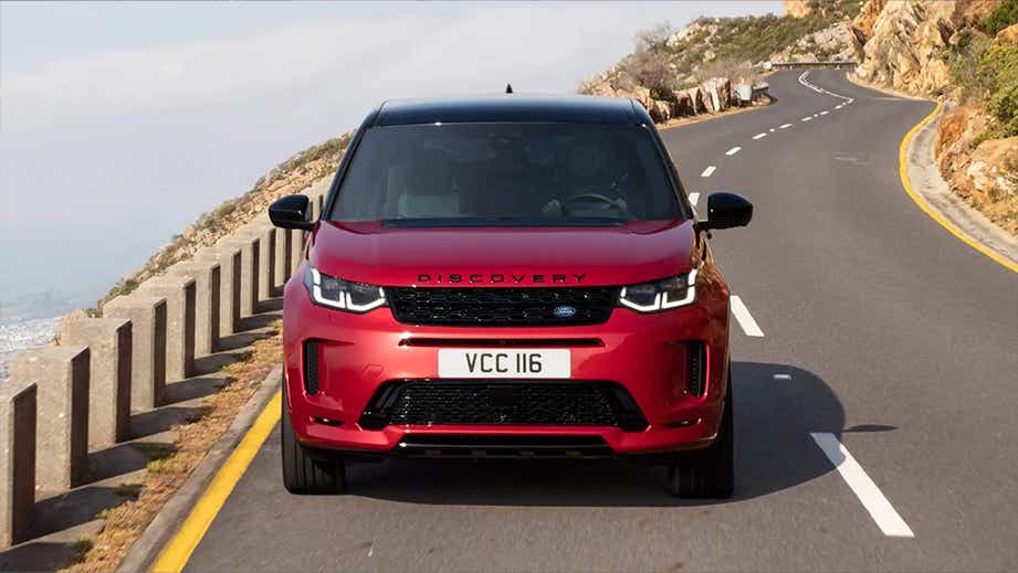 Front view of a Firenze Red Land Rover Discovery Sport