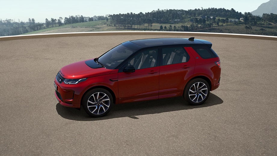 side profile of a Firenze Red Land Rover Discovery Sport