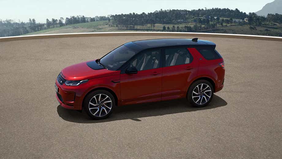 side profile of a Firenze Red Land Rover Discovery Sport