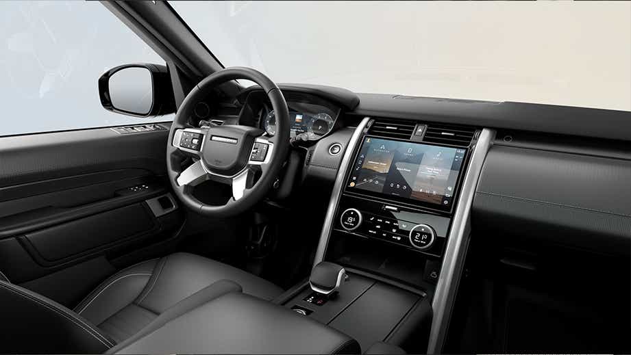 Interior dashboard and steering wheel of a Land Rover Discovery
