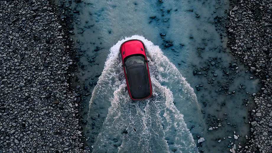 aerial top view of a Land Rover Range Rover Sport driving through water