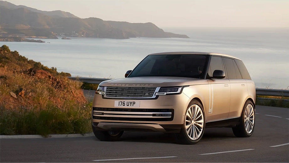 Front view of a Land Rover Range Rover on a coastal road