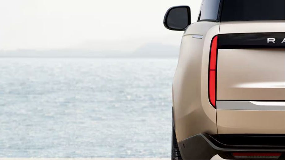 Rear view of a Land Rover Range Rover by the seaside