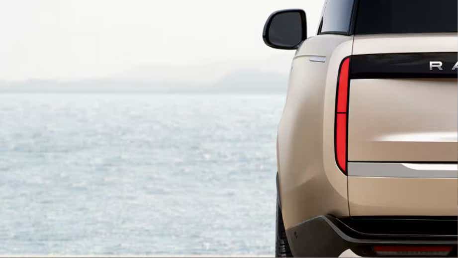 Rear view of a Land Rover Range Rover by the seaside