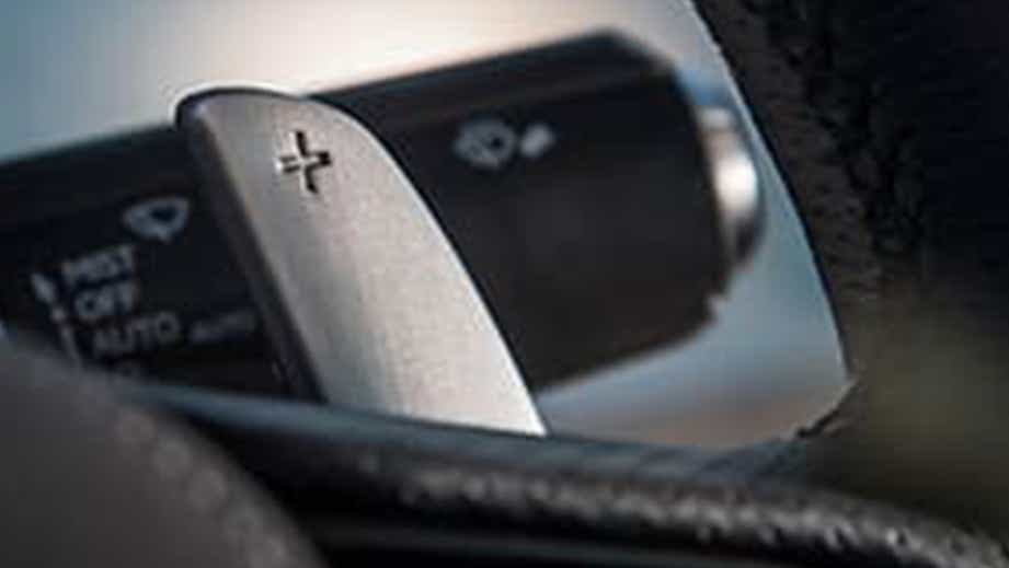 Close-up of steering wheel paddle shifter in a Lexus LC 500h