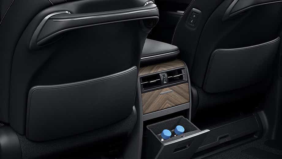 Rear seat and center console view of a Sonic Agate Lexus LM