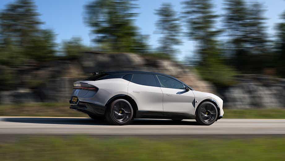 side view of a Lotus Eletre driving on a road