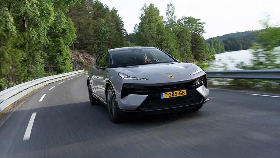 front view of a Blossom Grey Lotus Eletre on a winding road