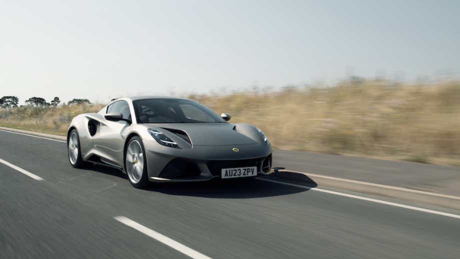front three-quarter view of a Lotus Emira driving on road