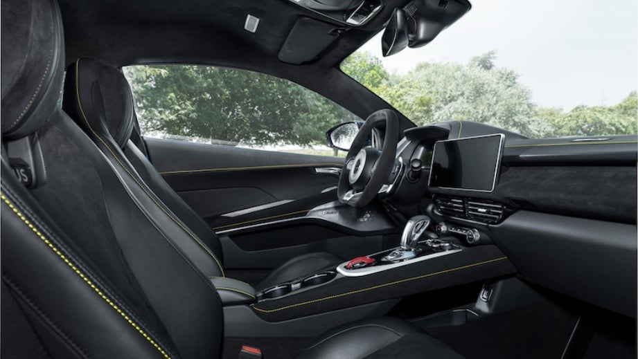 Interior dashboard and front seats of a Lotus Emira
