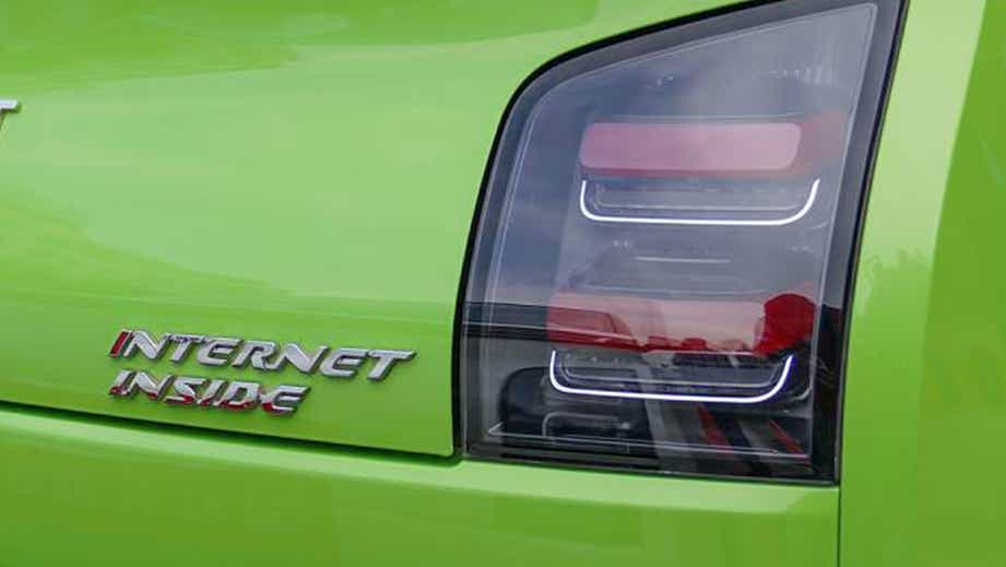 Tail light view of a Apple Green With Starry Black MG Comet EV