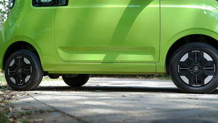 side profile lower body of a Apple Green With Starry Black MG Comet EV