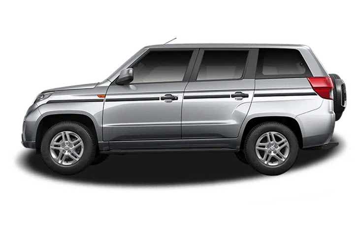 side view of a Majestic Silver Mahindra Bolero Neo Plus