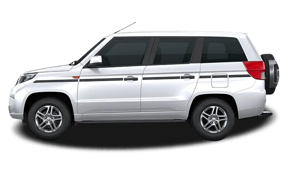 side view of a Diamond White Mahindra Bolero Neo Plus