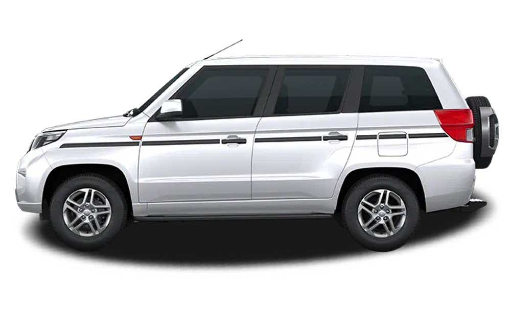 side view of a Diamond White Mahindra Bolero Neo Plus