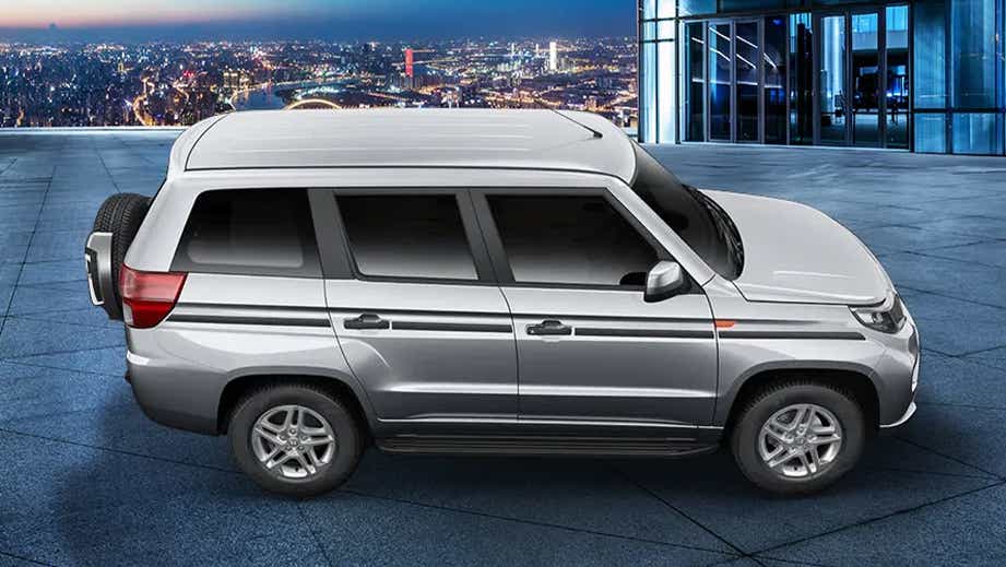 side view of a Majestic Silver Mahindra Bolero Neo Plus