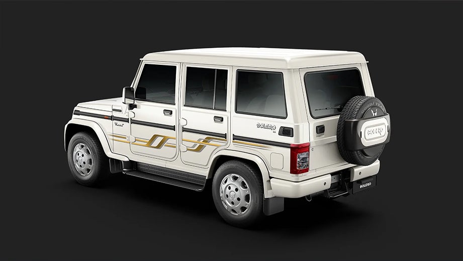 rear three-quarter view of a Diamond White Mahindra Bolero