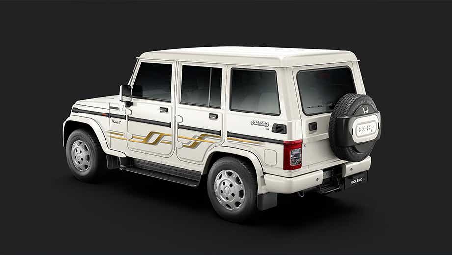 rear three-quarter view of a Diamond White Mahindra Bolero