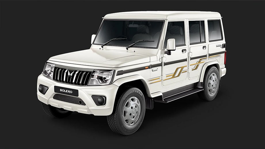 front three-quarter view of a Diamond White Mahindra Bolero