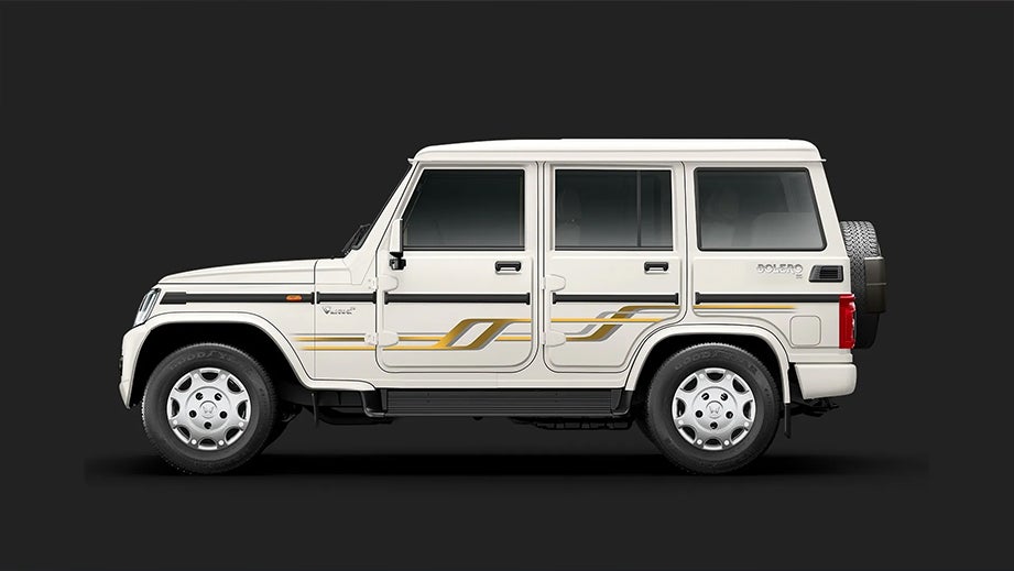 side view of a Diamond White Mahindra Bolero