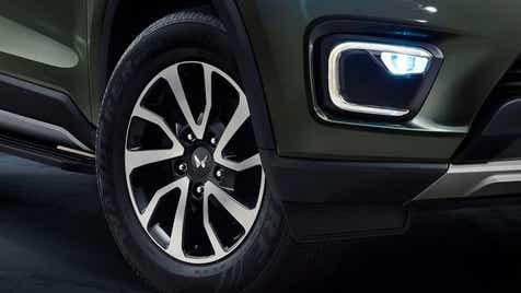 Front wheel and fog lamp area of a Mahindra Scorpio-N
