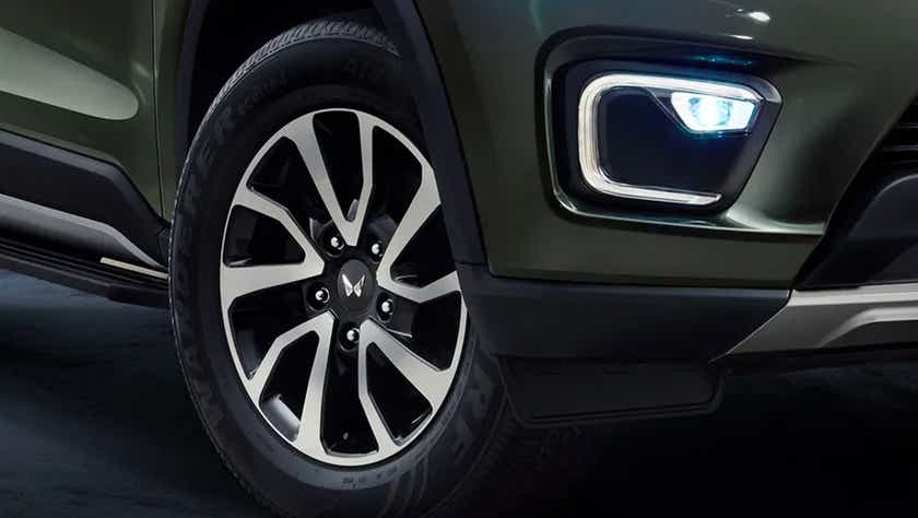 Front wheel and fog lamp area of a Mahindra Scorpio-N