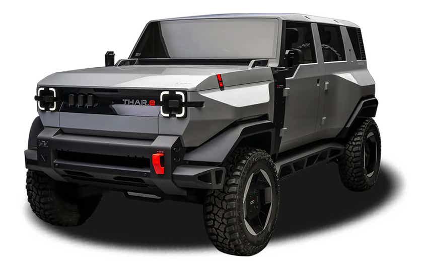 front three-quarter view of a Dazzling Silver Mahindra Thar E