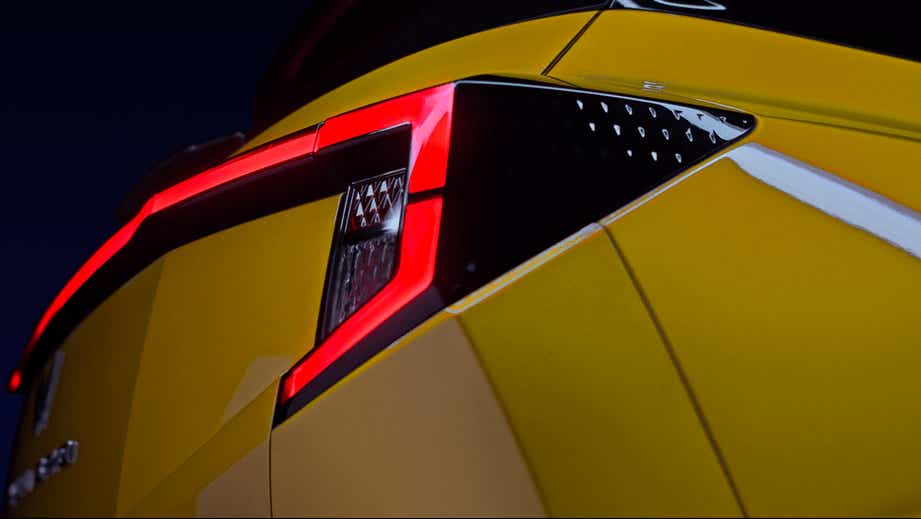 Tail light close-up of a Citrine Yellow Mahindra XUV 3XO
