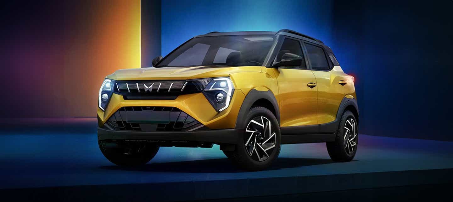 Front three-quarter view of a Citrine Yellow Mahindra XUV 3XO
