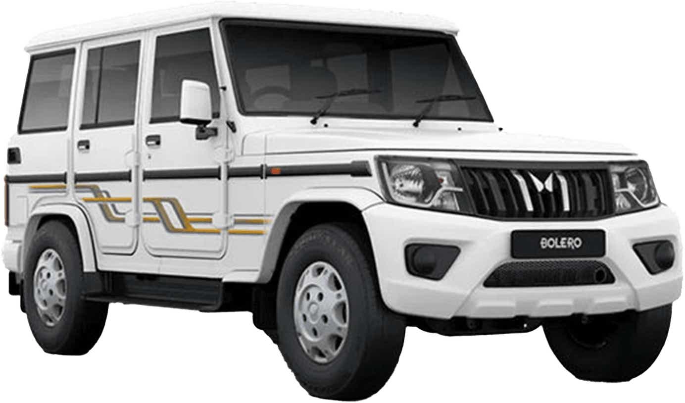 front three-quarter view of a Diamond White Mahindra Bolero