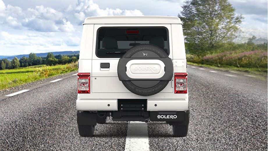 Rear view of a Diamond White Mahindra Bolero