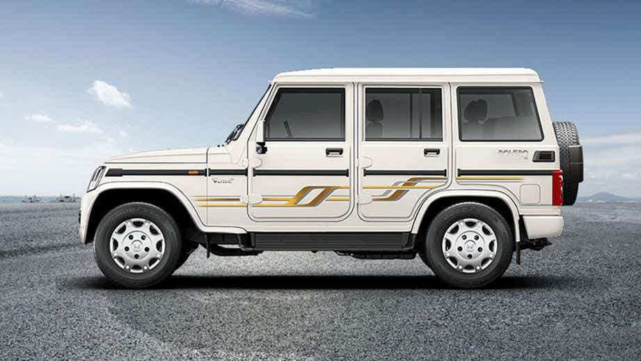 side view of a Diamond White Mahindra Bolero