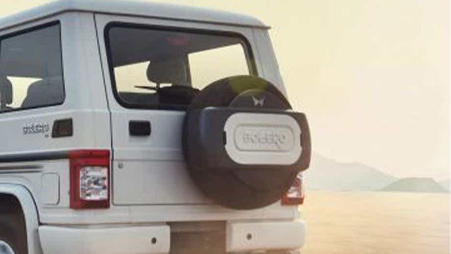 rear view of a Diamond White Mahindra Bolero