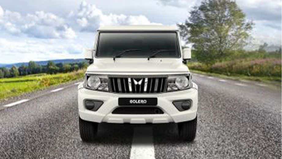 Front view of a Diamond White Mahindra Bolero